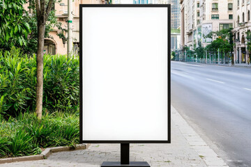 Blank advertising billboard on a city street, ready for promotion or announcements.