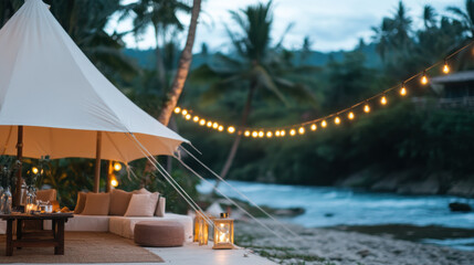 Obraz premium luxury glamping setup by pristine stream, featuring cozy seating and warm lights, creating serene atmosphere. Perfect for relaxation and nature lovers