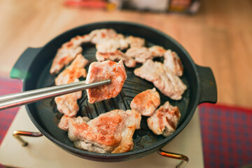 Chopsticks with Korean, Grilled, Pork, close-up of food