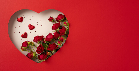 Red heart-shaped design featuring roses and heart decorations for Valentine's Day celebration