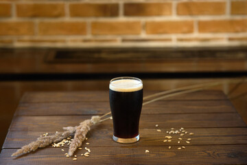 Enjoying a Glass of Dark Beer