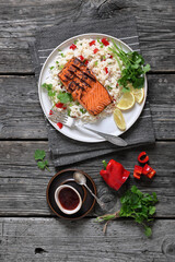 grilled red salmon fillet with rice, top view