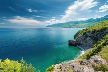 A dramatic cliffside view overlooking a vast ocean.