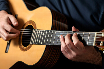Obraz premium visually impaired musician playing classical guitar