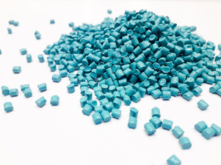 Bright blue masterbatch granules on white background, polymer carrier of color pigment in plastic industry. Perfect for plastic company catalog design.