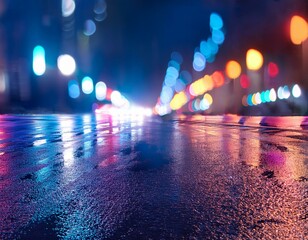 Rainy night in the city. Headlights approaching cars. Reflections of street lamps on the wet asphalt. 
