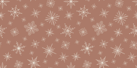 Christmas seamless pattern with snowflakes in a milky color on a mocha mousse background 