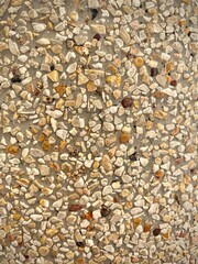 The background of small pieces of stone are combined to form a beautiful wall. background of stones. 