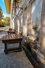 a place for washing feet in a mosque, a bench and a faucet with water, a tradition of the Islamic...