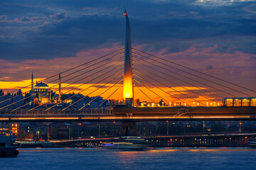 Fototapeta premium view from a pleasure boat on the Bosphorus and the cityscape of Istanbul, Turkey, the architecture of the city at sunset, a popular tourist destination.