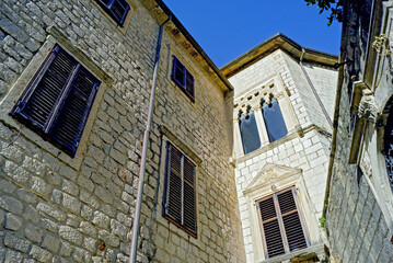 Historical monuments in the Old Town of Kotor, Montenegro: the facade of the Drago family palace facing the St. Tryphon square. Architecture of the Bay of Kotor: a house with Venetian Baroque decor