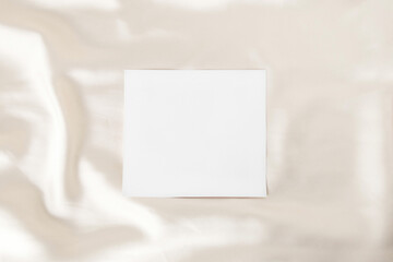 Satin fabric and empty white paper