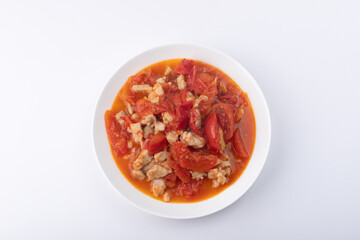 Roast pork with tomatoes on a plate