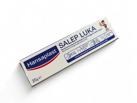 Hansaplast Salep Luka isolated on white background,This cream functions to help the healing process of wounds and restore damaged skin,hansaplast brand