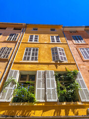 Yellow facade of a French building in Aix en Provence