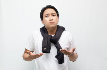 Young Asian Man Deep in Thought with a Pensive Expression