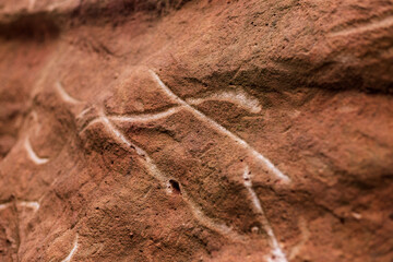 Natural red stone gouge marks left by a stone chipper