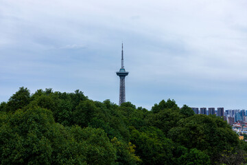 Fototapeta premium The landmark TV tower is seen from the Bell and Drum Tower in Deyang city, Sichuan Province, China