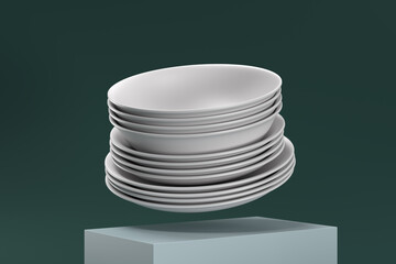 A stack of white plates is on top of a cube