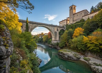 Fototapeta premium Captivating Documentary Photography of Natisone River and Devil's Bridge in Cividale del Friuli, Showcasing Stunning Natural Landscapes and Historic Architecture