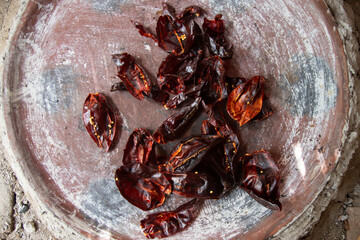 Preparing Mexican Mole Negro. Oaxaca chiles have to be cleaned, toasted on a comal over a flame and...