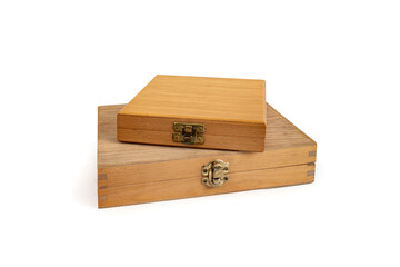 Wooden boxes with closed lid stacked and isolated on white background, abstract gift concept