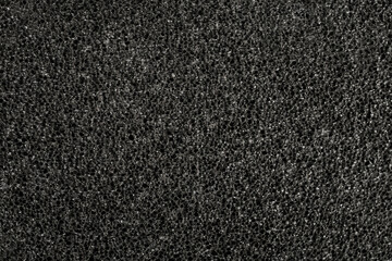 Black color pumice stone, close up structure , abstract backdrop