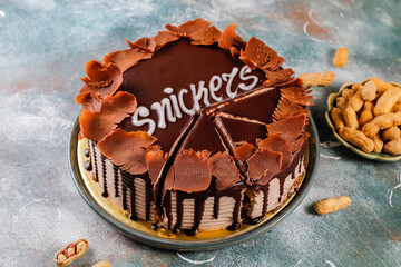 Snickers cake with caramel, peanuts and buttercream.