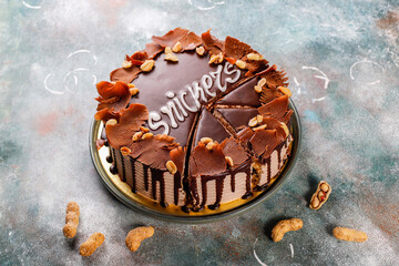 Snickers cake with caramel, peanuts and buttercream.