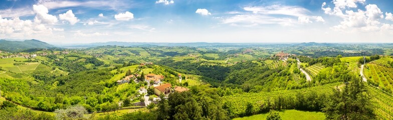Panoramic view of the vineyards valley in the Brda area and ancient town of Smartno, Slovenia