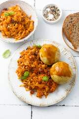 Stewed cabbage with dumplings and gravy