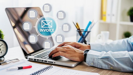 Hands typing on a laptop with a digital invoice interface, symbolizing modern financial solutions.