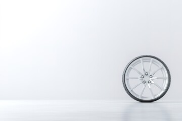 luxury alloy wheel with intricate detailing placed on seamless white surface