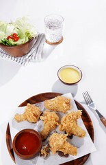 Fried Chicken Drumsticks and Vegetable Salad food on a white background