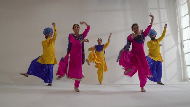 Sikh People performing bhangra during Baisakhi celebration