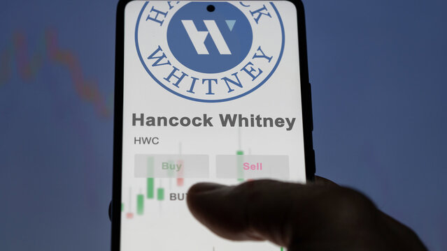 March 26th 2024, logo of Hancock Whitney on a white wall in a hall building, the $HWC brand indoor.