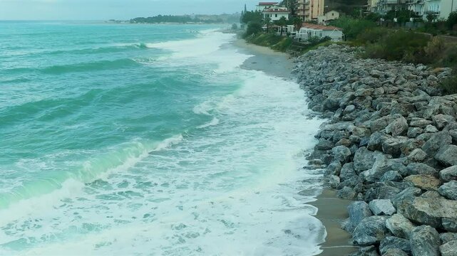 ROUGH SEA, WAVES BEATING ON THE STONES ON THE COAST OF CALABRIA 3A