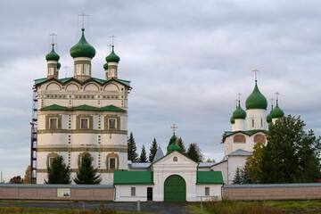 At the entrance to the old Nikolo-Vyazhischsky monastery on a cloudy October morning. Neighborhood of Veliky Novgorod, Russia