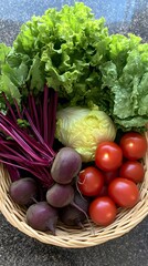A basket of vegetables, including lettuce, tomatoes, and beets