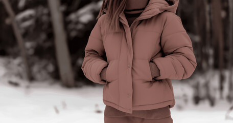 mocha mousse brown women’s puffer jacket with cozy sweater in snowy forest for winter fashion