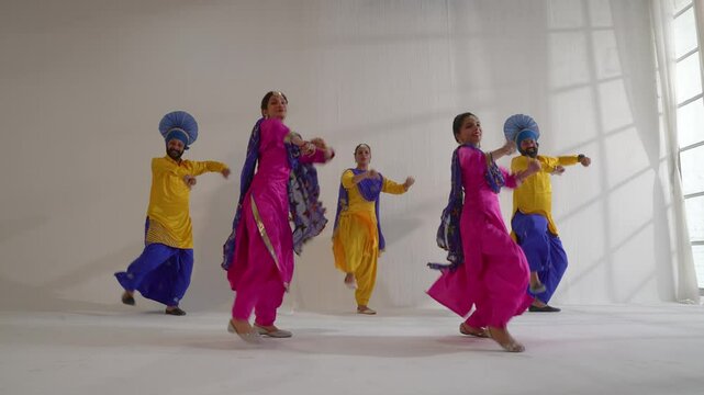 Sikh People performing bhangra during Baisakhi celebration