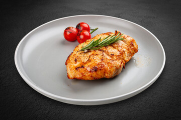 Grilled chicken breast with rosemary and cherry tomatoes