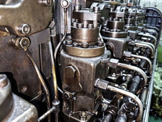 Fototapeta premium Close up view of fuel pumps of old 6 cylinder diesel engine