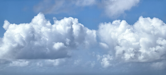 White fluffy clouds in a blue sky