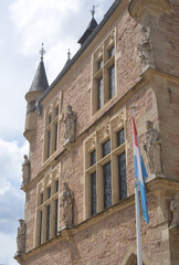 City Hall, Echternach, Luxembourg, facade vertical detail with flag of Luxembourg