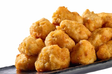 Close-up of crispy golden chicken nuggets.