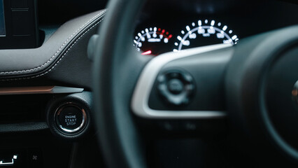 Fototapeta premium Interior of a modern car with a start button. Concept of comfort, innovative technology, and stylish design for driver convenience.
