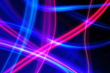 Fototapeta premium Vibrant Abstract Light Trails in Blue and Pink Against a Dark Background