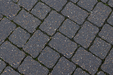 Block paving stones in grey closeup background