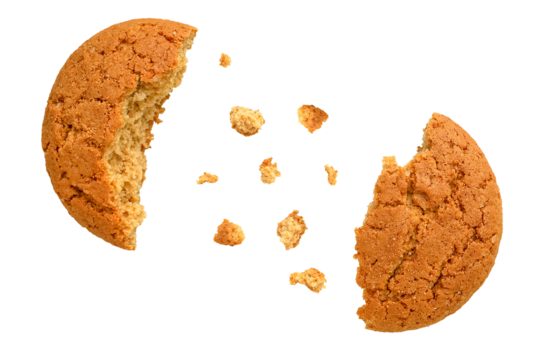 Oatmeal cookies broken in half with crumbs scattered chaotically. Isolated on a transparent background.